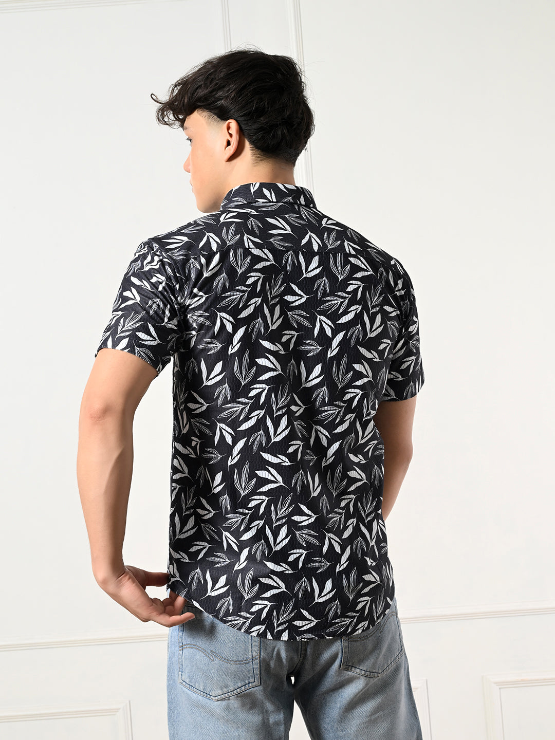 Modern black and white leaf print shirt.