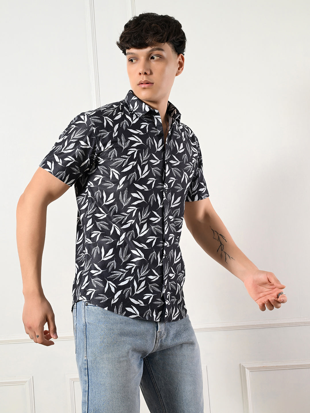 Modern black and white leaf print shirt.