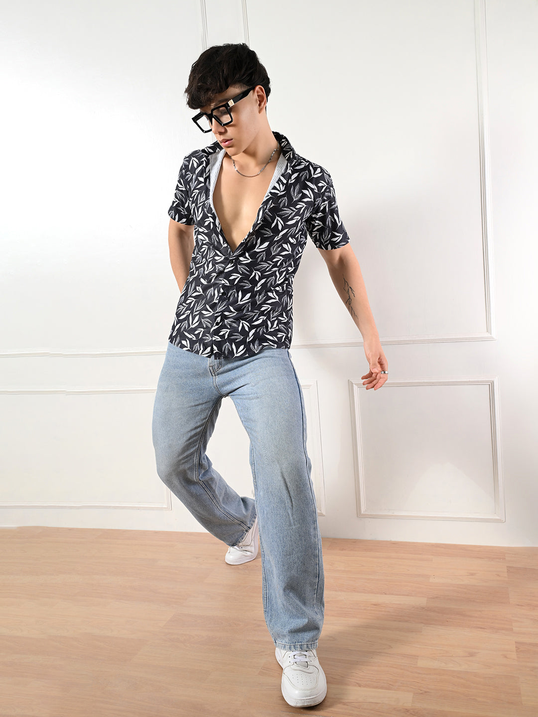 Men's black, white leaf print shirt.