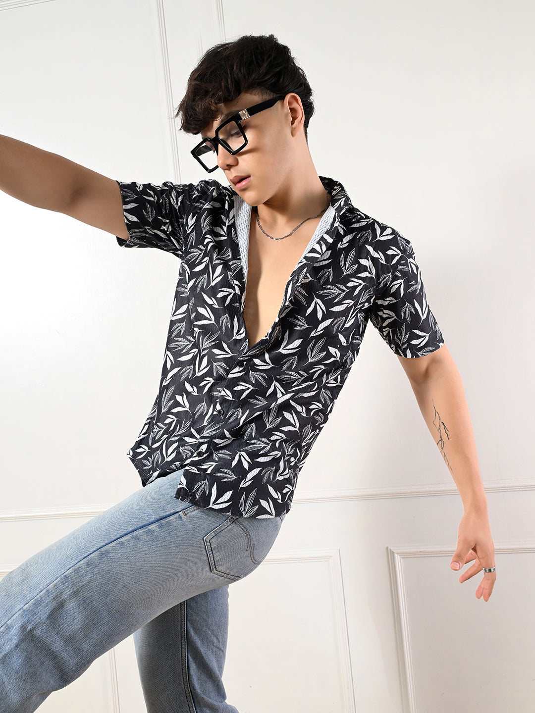 Men's black, white leaf print shirt.