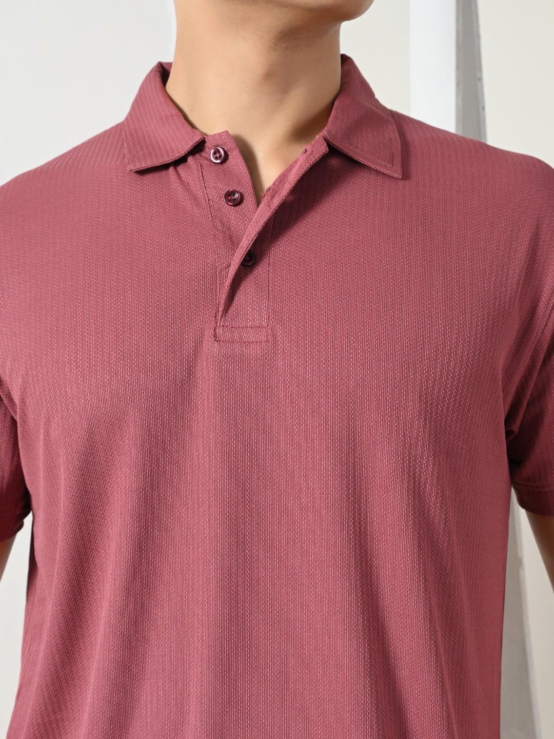 Men's maroon textured polo for everyday wear.