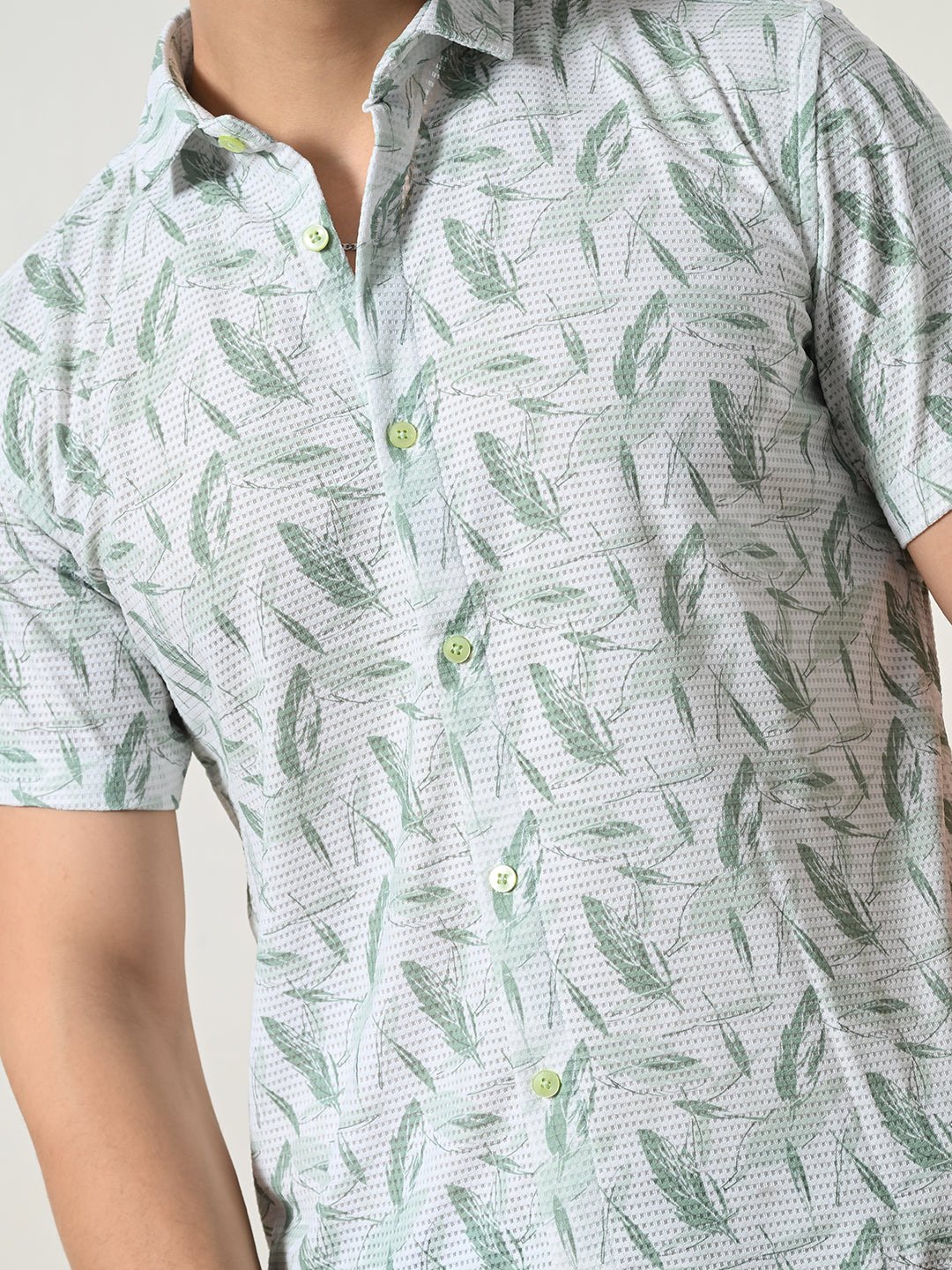 Men's refreshing light blue, green leaf shirt.
