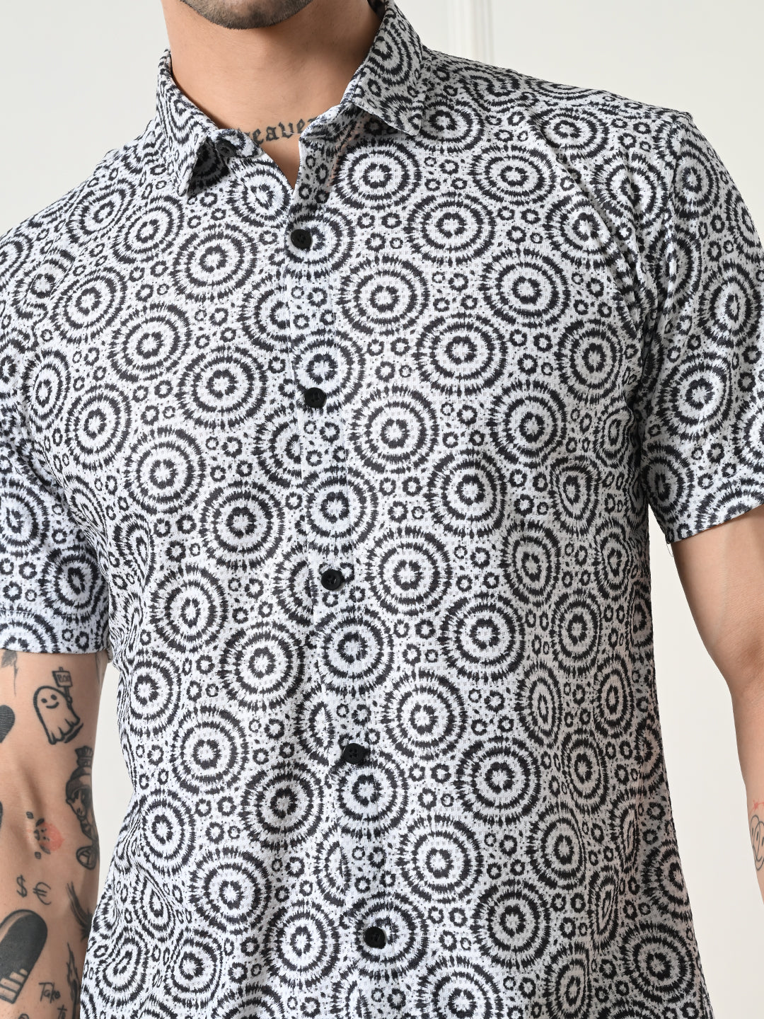 Men's black and white geometric circle shirt.